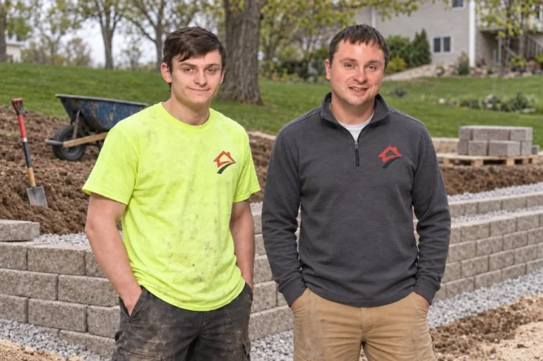 A1 Property Services crew on a retaining wall jobsite in Cedar Falls, Iowa