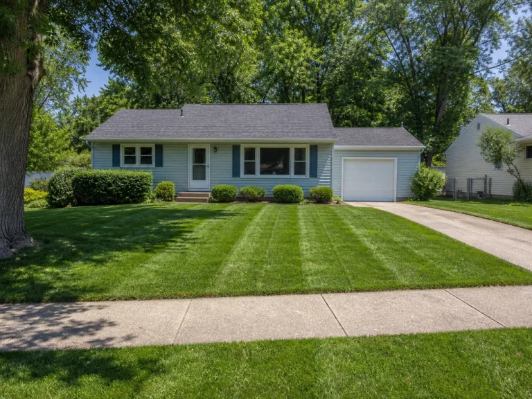 Freshly mowed lawn with crisp edging in Evansdale, Iowa