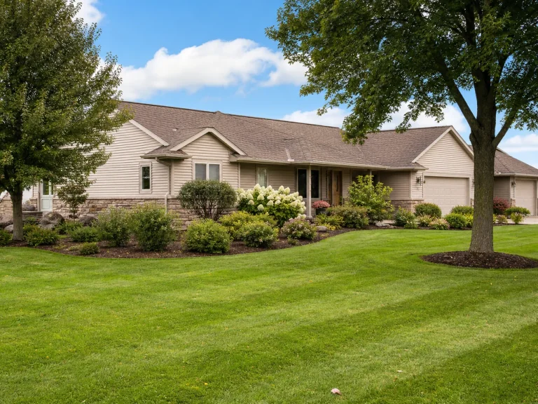 Neat foundation landscaping and trimmed lawn in La Porte City, Iowa