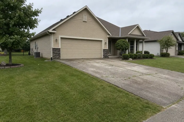 Cracked concrete driveway before paver replacement