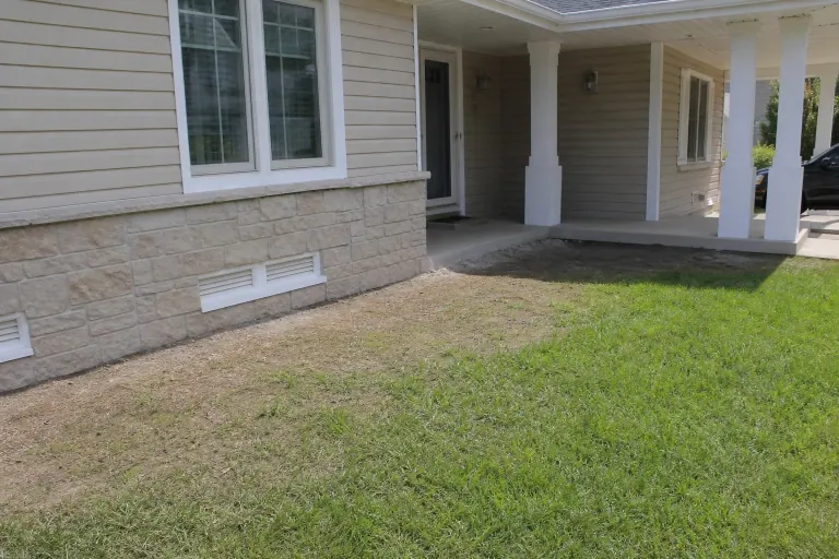 Bare foundation strip before landscape bed installation