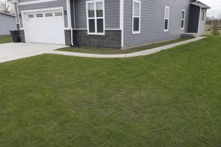 Plain front lawn before island planting bed installation