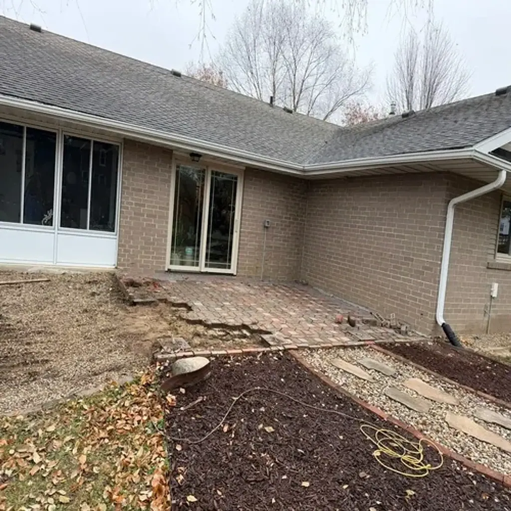 Damaged patio before paver patio replacement