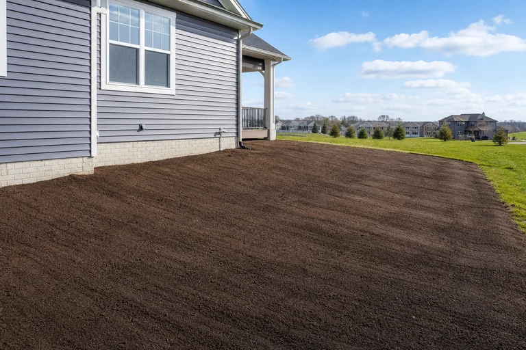 Yard grading and leveling for proper drainage