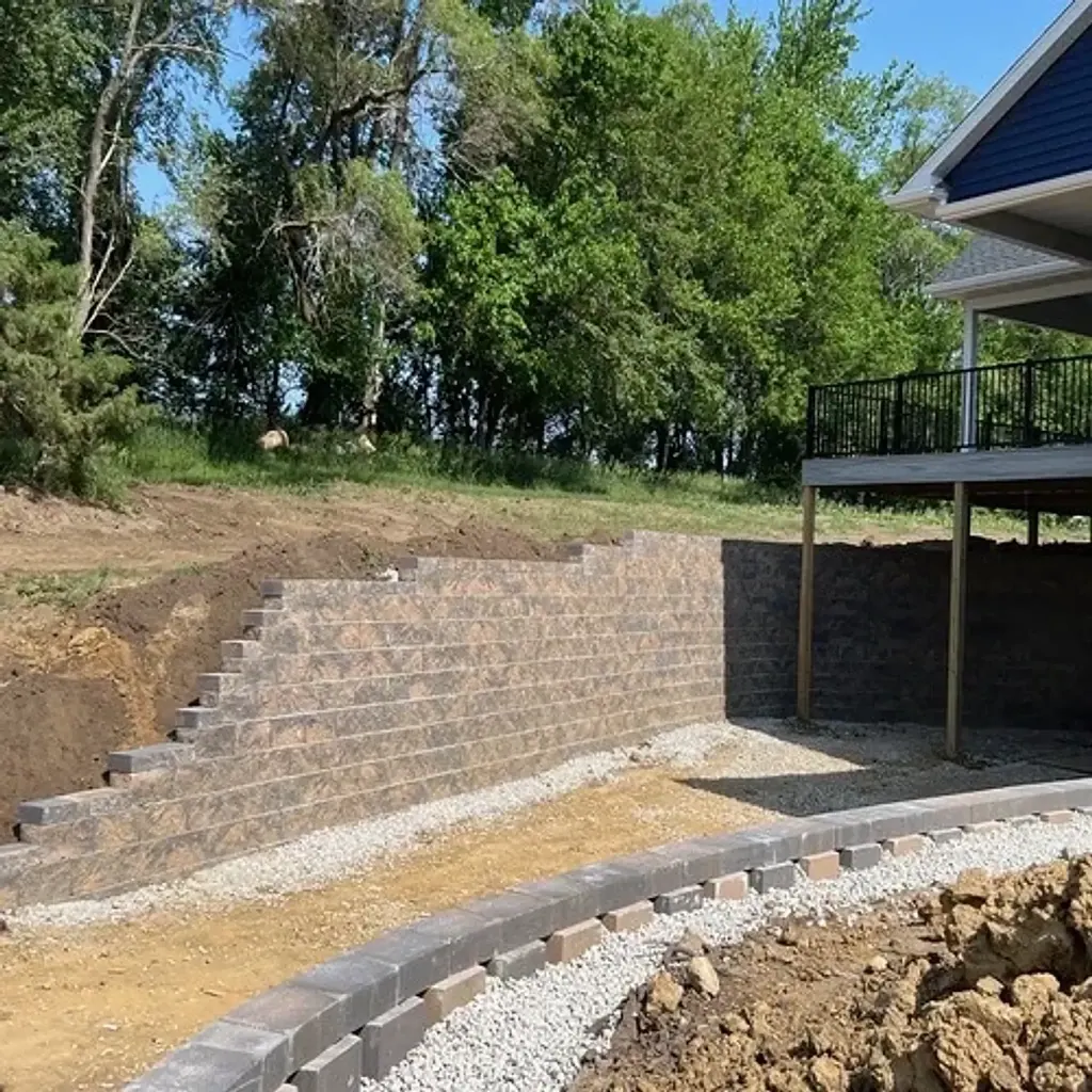 Retaining wall and patio foundation after installation