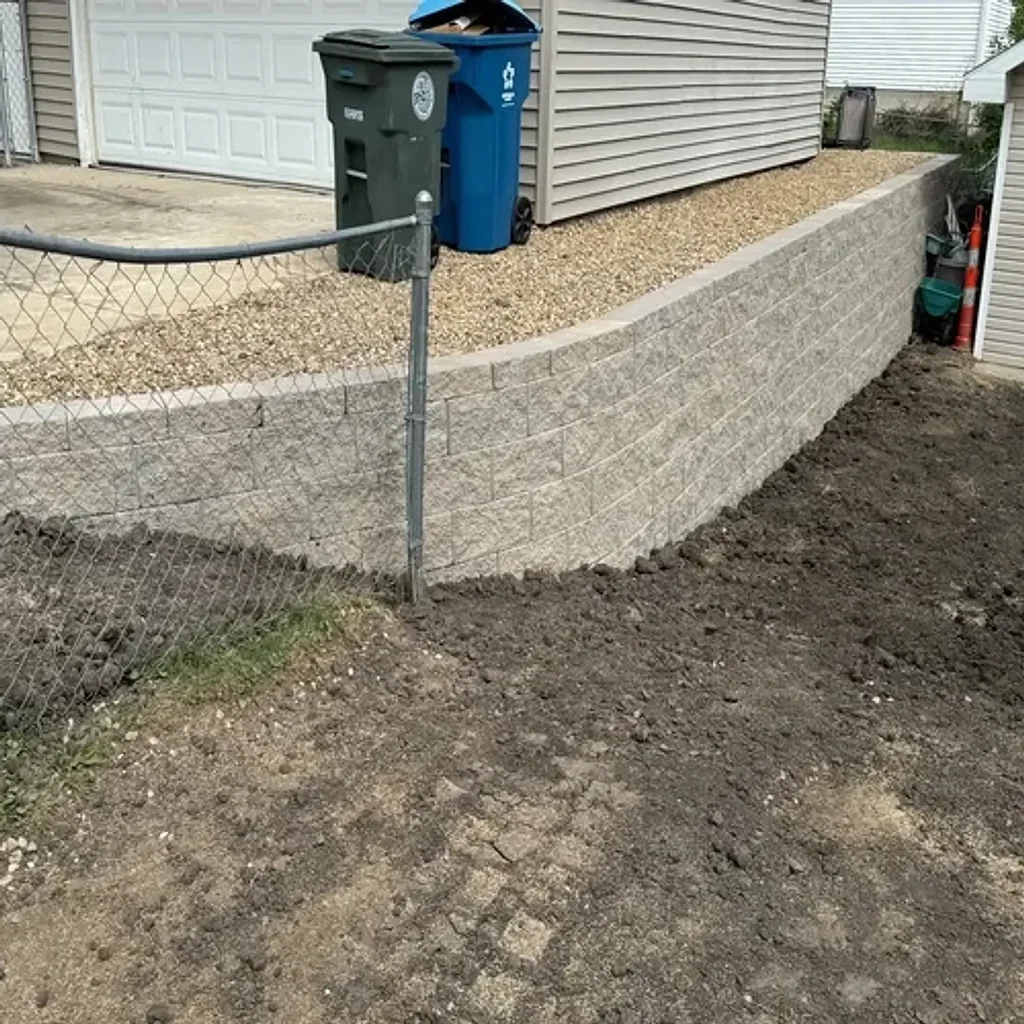 New retaining wall with pea gravel and clean finish