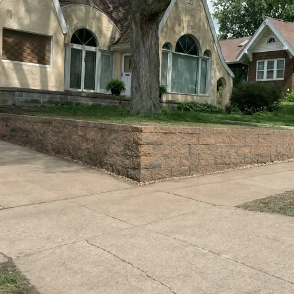 New L-shaped retaining wall with leveled front yard