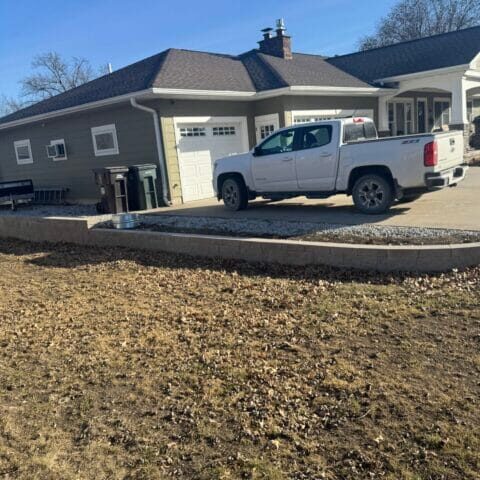Retaining wall in Cedar Falls, Iowa, built for stability and improved outdoor aesthetics.