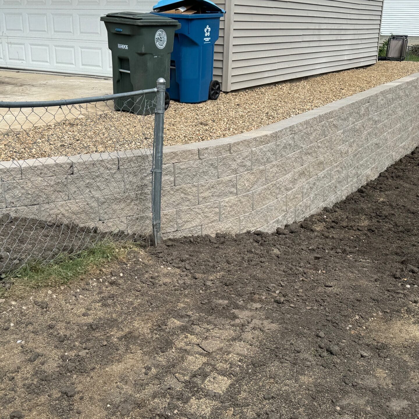 Retaining wall in Cedar Falls, Iowa, designed for stability and improved outdoor aesthetics.