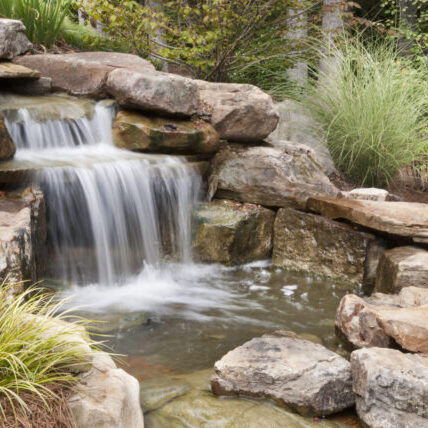 Pond in Cedar Falls, Iowa, creating a peaceful water feature within the landscape.