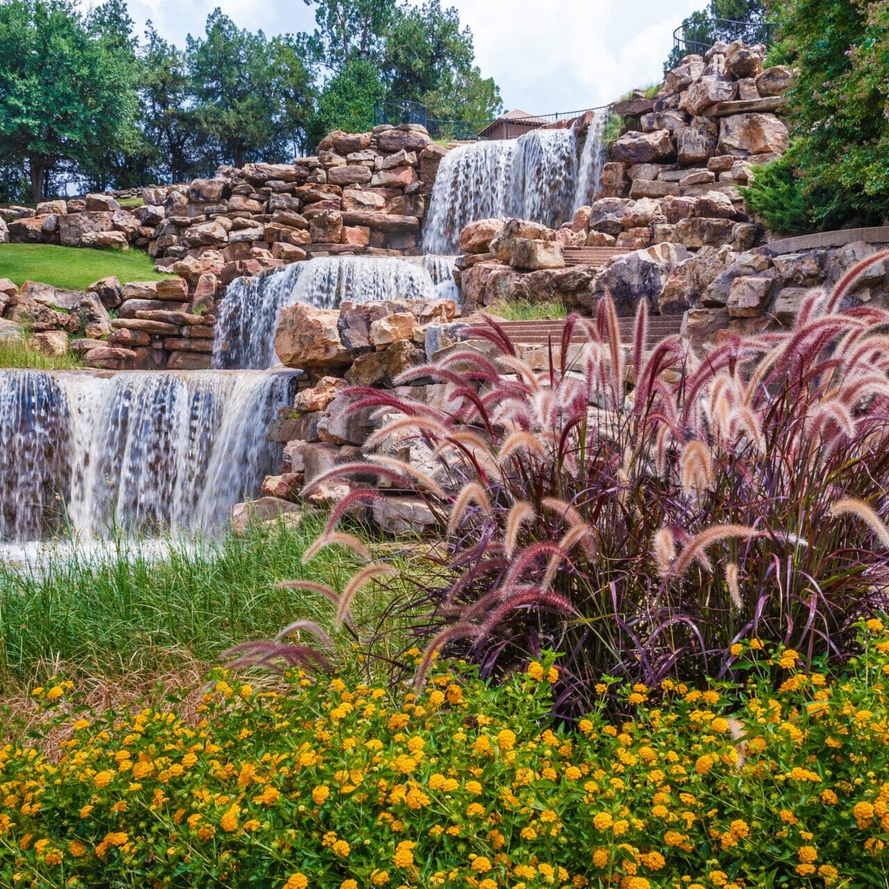 Waterfall in Cedar Falls, Iowa, creating a serene and natural outdoor water feature.