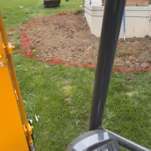 Before photo of a retaining wall site in Cedar Falls, Iowa, highlighting the landscape before installation.